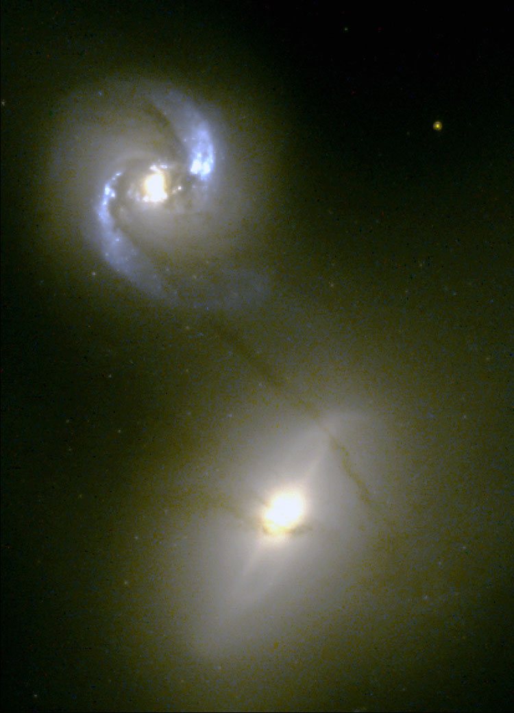HST image of spiral galaxy NGC 1409 and lenticular galaxy NGC 1410