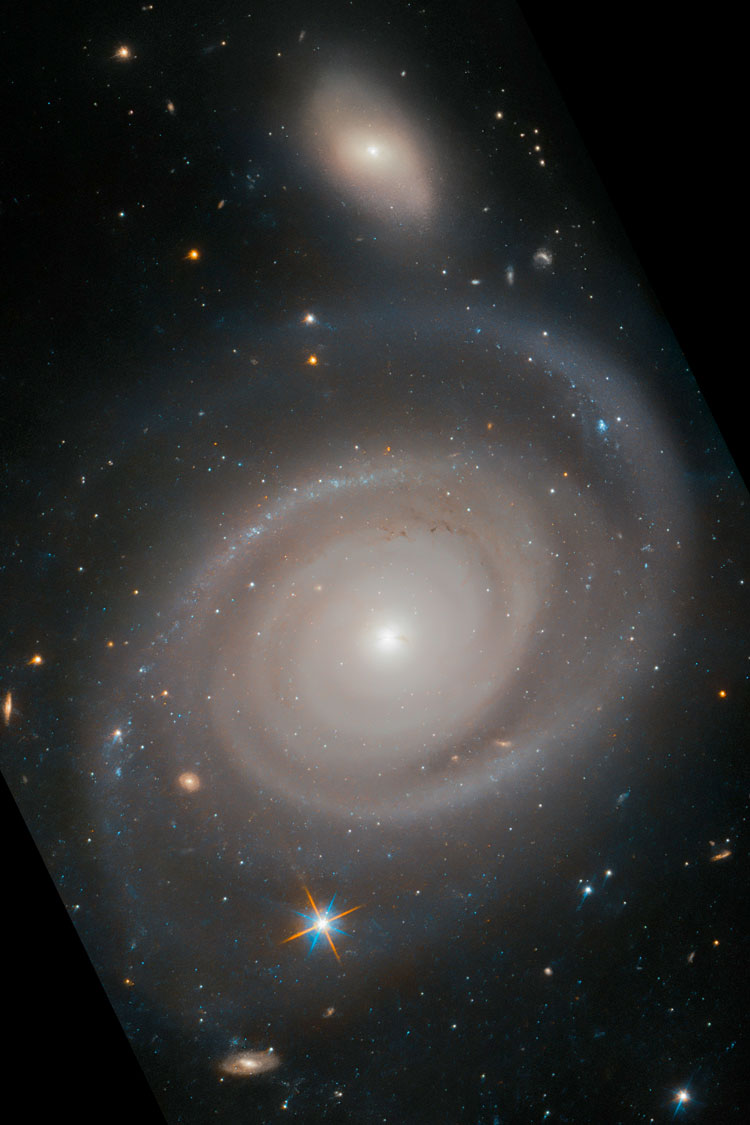 HST image of spiral galaxy NGC 1706, also showing PGC 177963