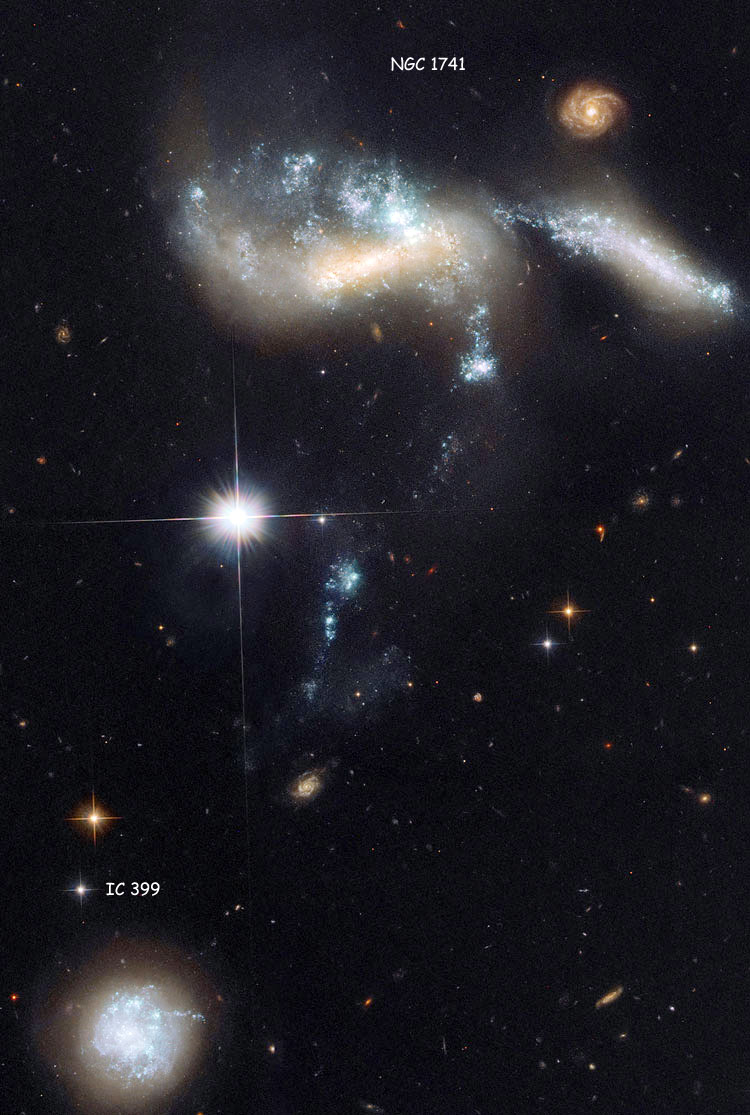 HST image of region between irregular galaxy IC 399, which is part of Hickson Compact Group 31, and peculiar galaxy group NGC 1741, which is also known as Arp 259 and is also part of Hickson Compact Group 31