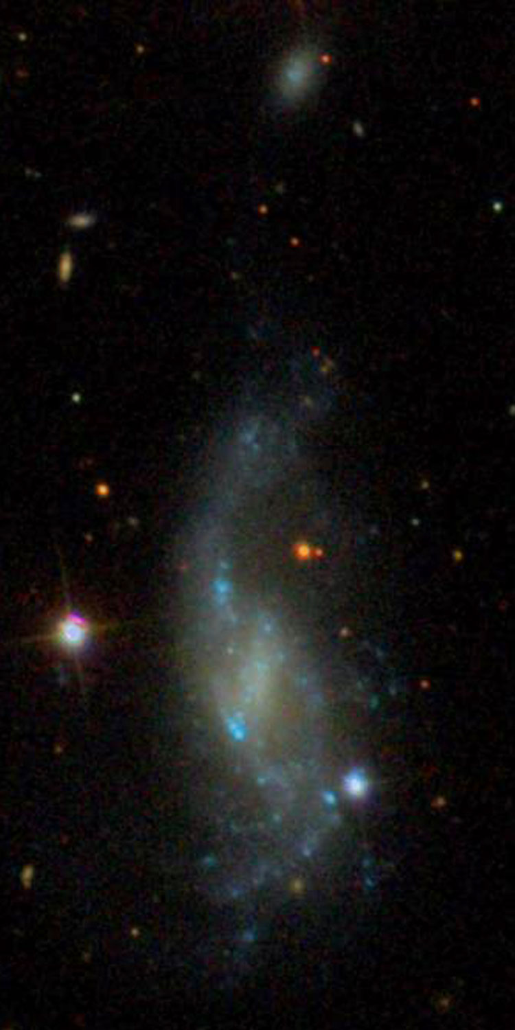 SDSS image of spiral galaxy NGC 3264, also showing SDSS J103217.22+560803.7
