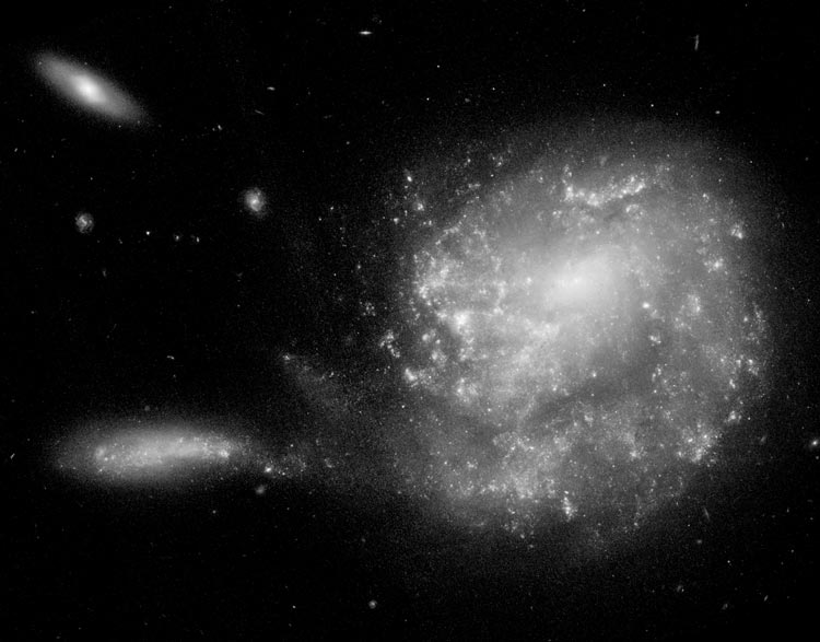 HST image of NGC 3445, which is Arp 24, also showing PGC 32784 and spiral galaxy PGC 2554198
