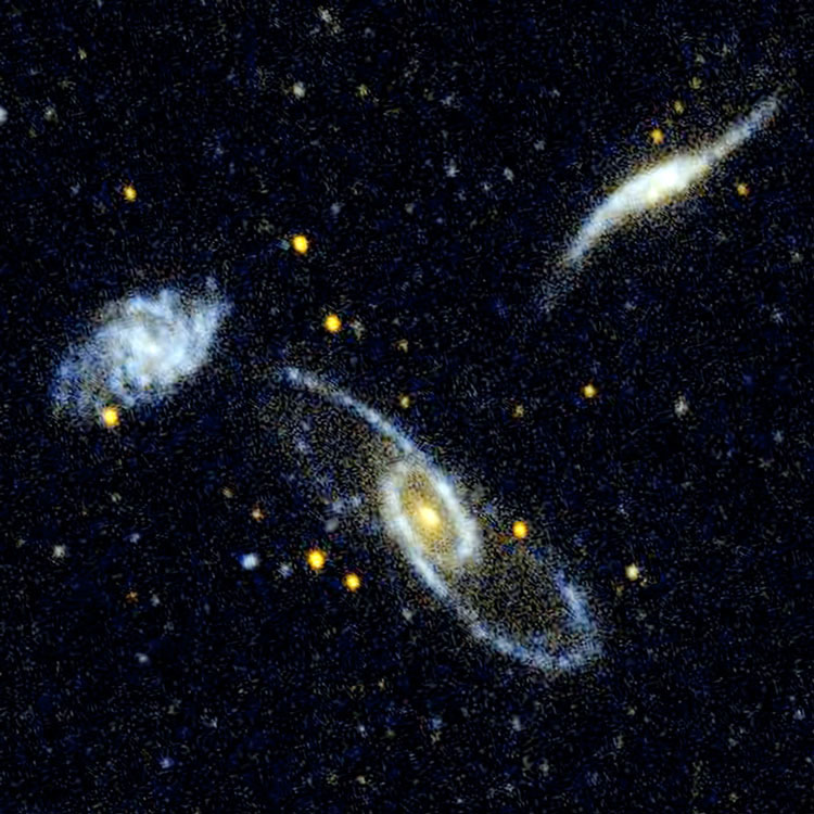 GALEX image of spiral galaxies NGC 5560, 5566 and 5569, also known as Arp 286