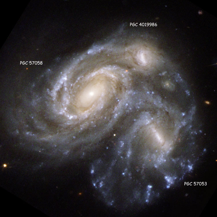 Labeled HST image of the apparently colliding spiral galaxies that comprise NGC 6050, also known as Arp 272