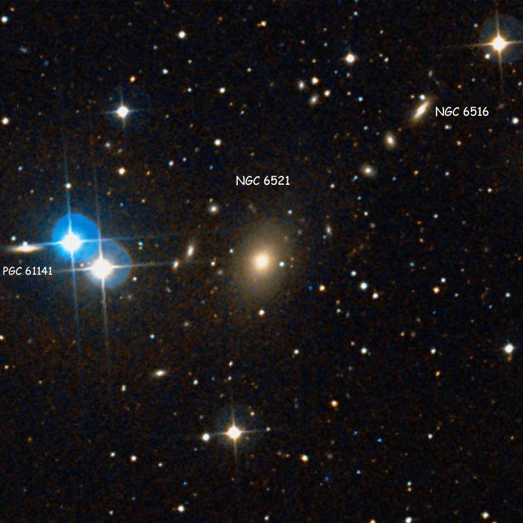 DSS image of region near elliptical galaxy NGC 6521, also showing spiral galaxies NGC 6516 and PGC 61141