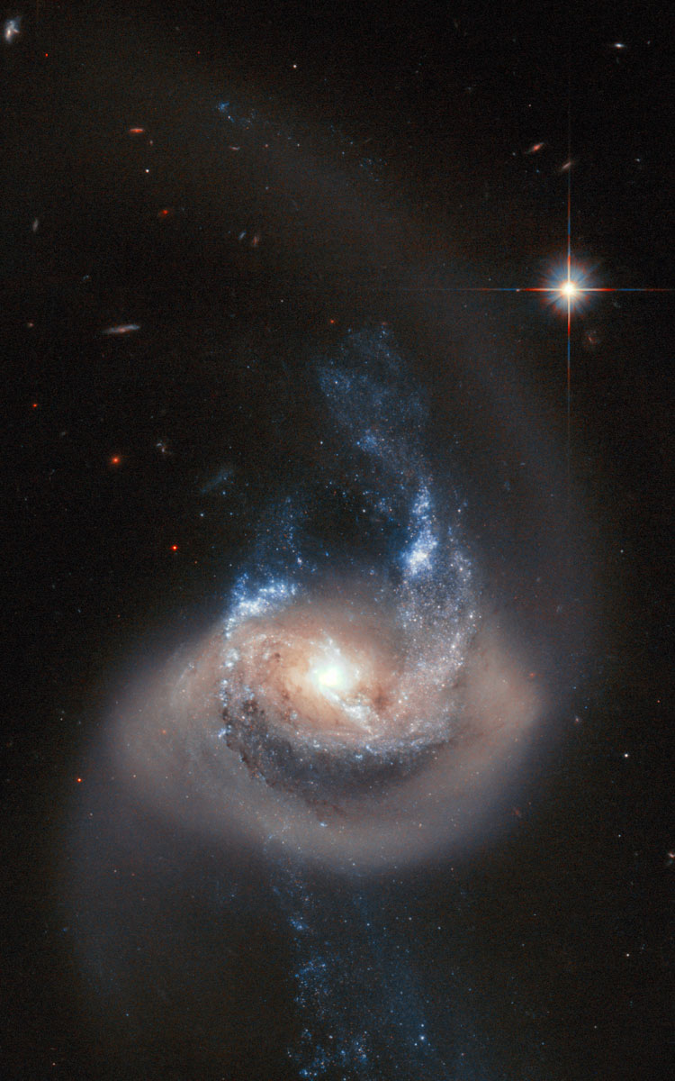 HST image of spiral galaxy 7714, which is part of Arp 284, also showing part of NGC 7715
