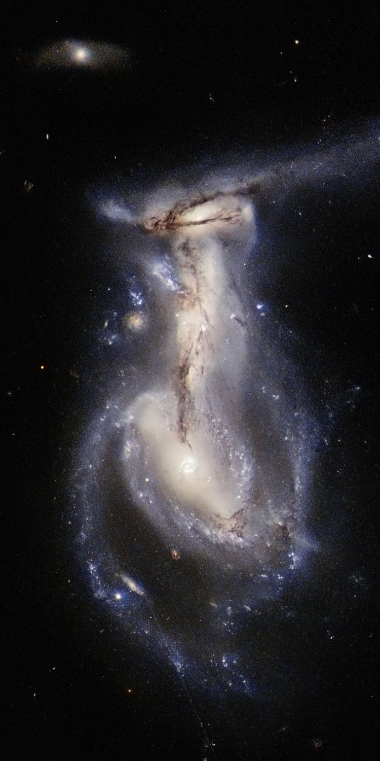 HST image of the interacting triplet of galaxies known as Arp 195