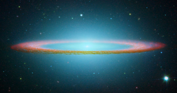 Spitzer/HST false-color composite of spiral galaxy NGC 4594, also known as the Sombrero Galaxy, M104