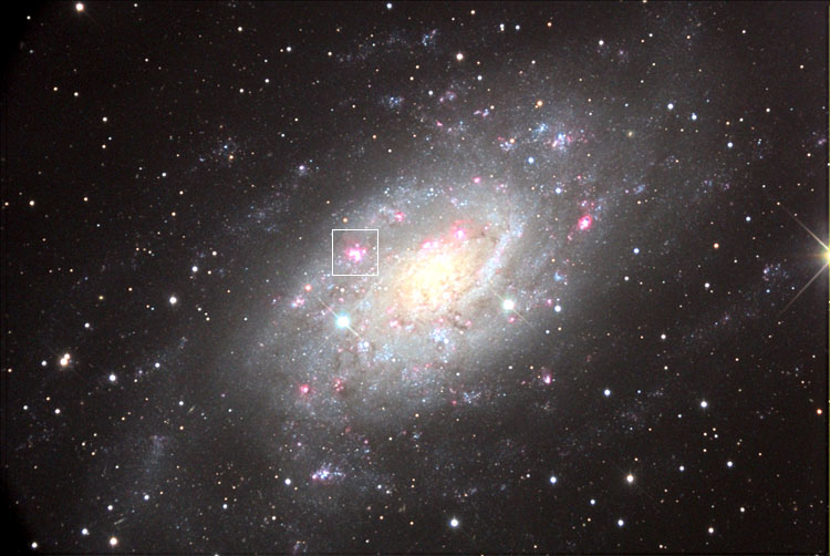 NOAO image of spiral galaxy NGC 2403, showing the location of emission nebula and star-forming region NGC 2404