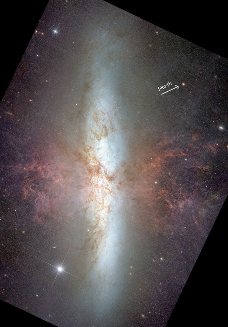 HST image of spiral galaxy NGC 3034, also known as M82, emphasizing the material ejected from the nucleus