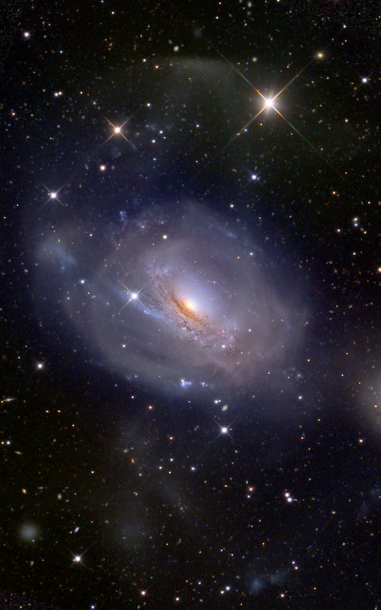 Mount Lemmon SkyCenter image of spiral galaxy NGC 3169, showing arcs and patches of gases and stars scattered hither and yon by its interaction with NGC 3166