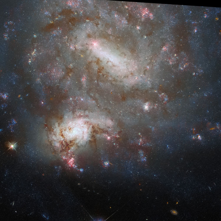 HST image of irregular galaxy PGC 41471 (often called NGC 4496A) and spiral galaxy PGC 41473 (often called NGC 4496B), which comprise the optical double NGC 4496