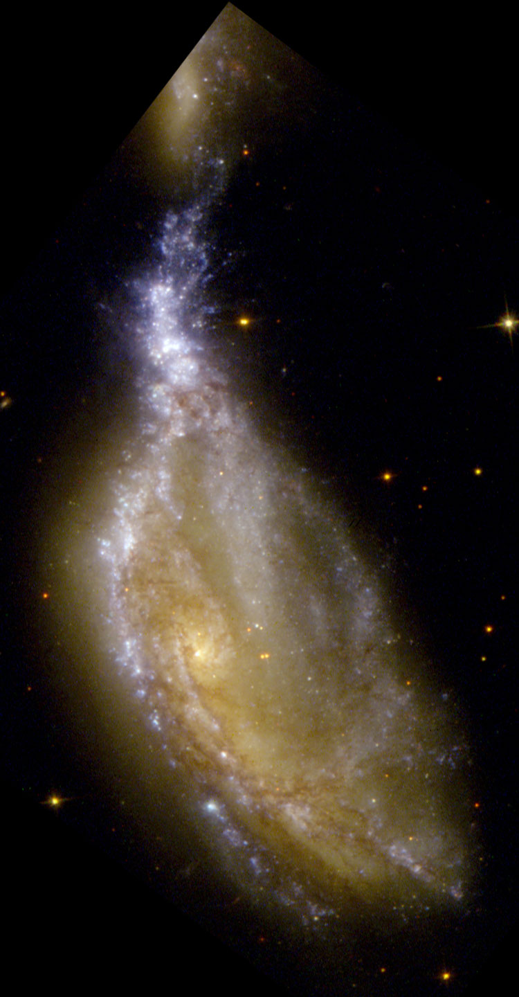 HST image of spiral galaxy NGC 6745 and part of its collisional neighbor, spiral galaxy PGC 200361
