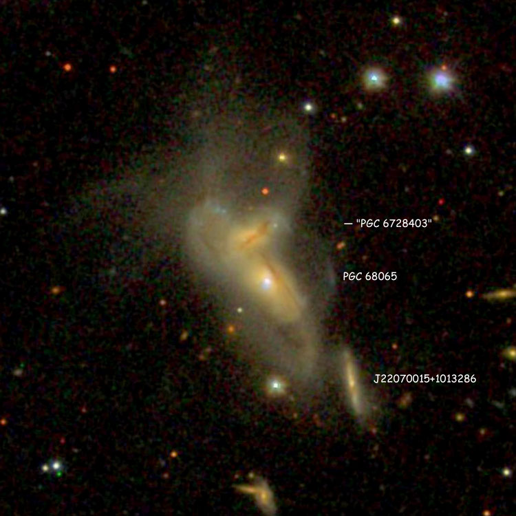 SDSS image of the interacting pair of peculiar spiral galaxies listed as NGC 7212, also showing their apparent companion, 2MASS J22070015+1013286