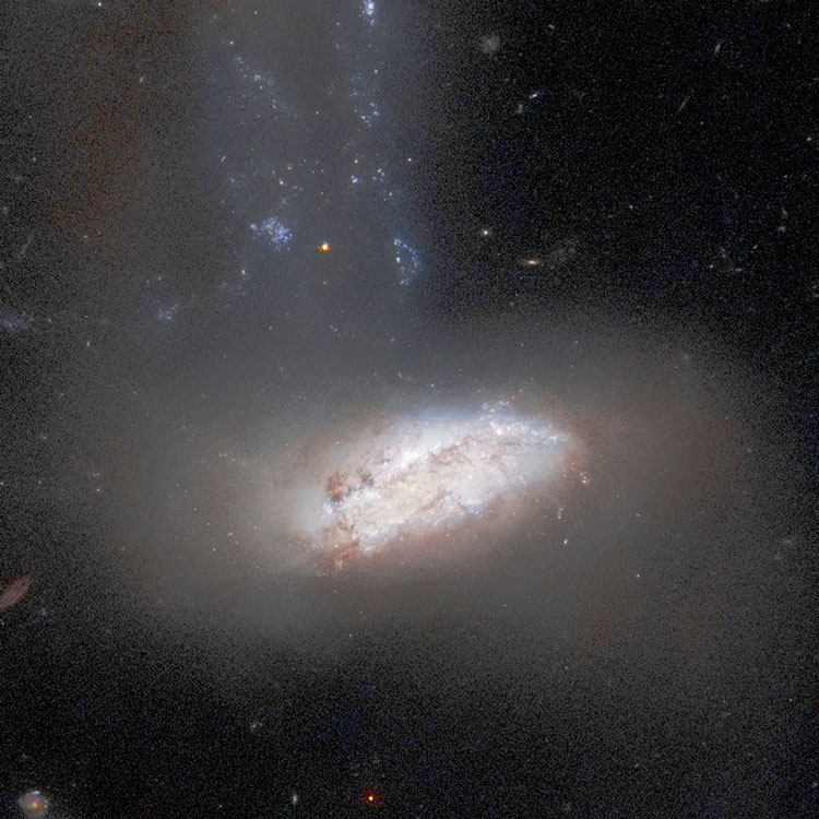 HST image of irregular galaxy NGC 7752 and part of its larger companion, NGC 7753, with which it comprises Arp 86