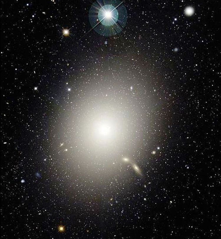CFHT image of elliptical galaxy NGC 4486, also known as M87; also shown (at upper right) is PGC 41327, also known as NGC 4486B