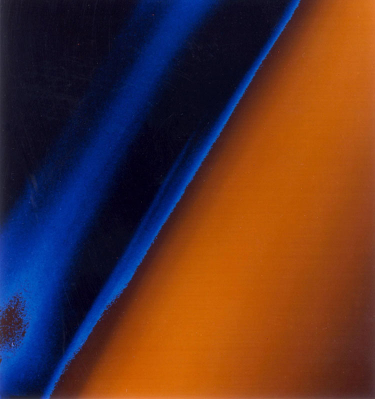 Voyager 1 image of blue and orange haze in the upper atmosphere of Titan as observed in 1980